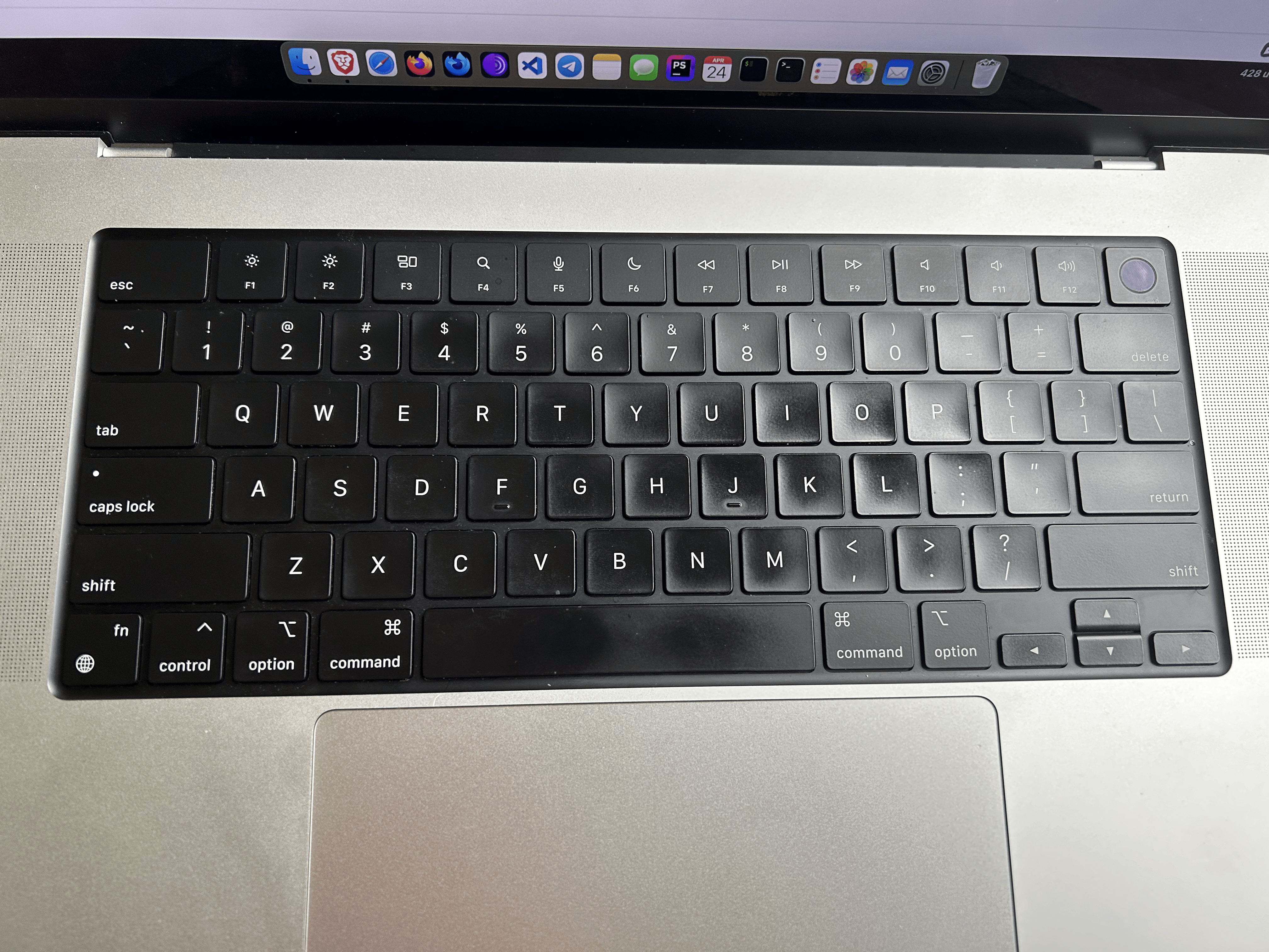 The photo of the keyboard after 2 years of using it. Some keys are polished