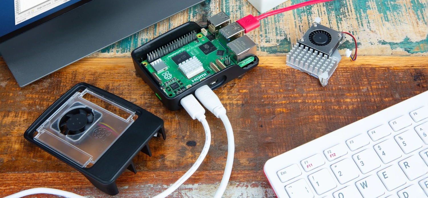 Raspberry Pi 5 in a case connected with USB cables connected