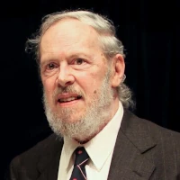 Dennis Ritchie, creator of C, at a computer